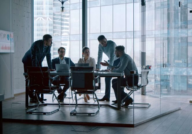 Young professionals having a discussion at a meeting in a modern office